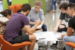 Students seated around a table