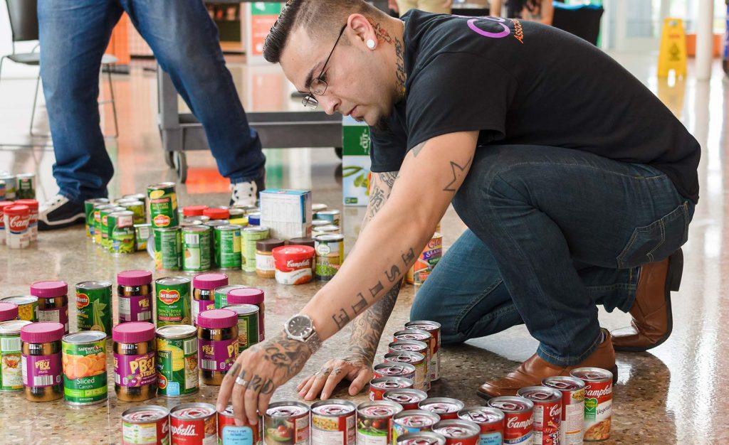 student organizing canned goods